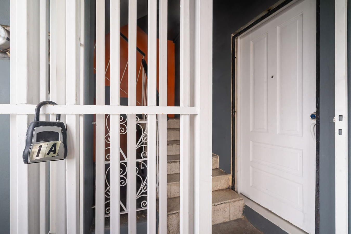 Entrance gate and front door, with a lockbox — Puerto House - Private Patio, Santurce