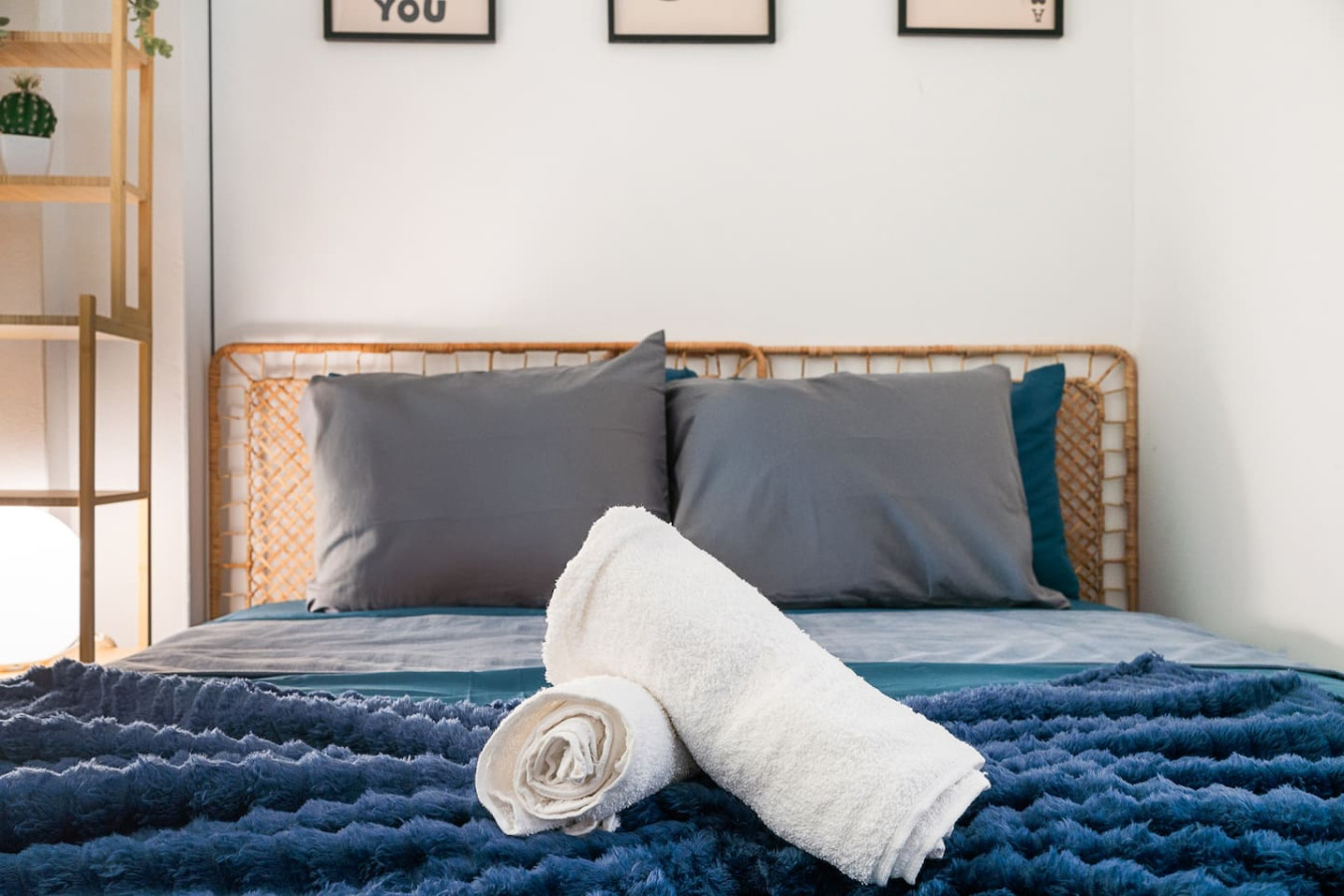 Bedroom with a bed and two towels on it — Puerto House - Private Patio, Santurce