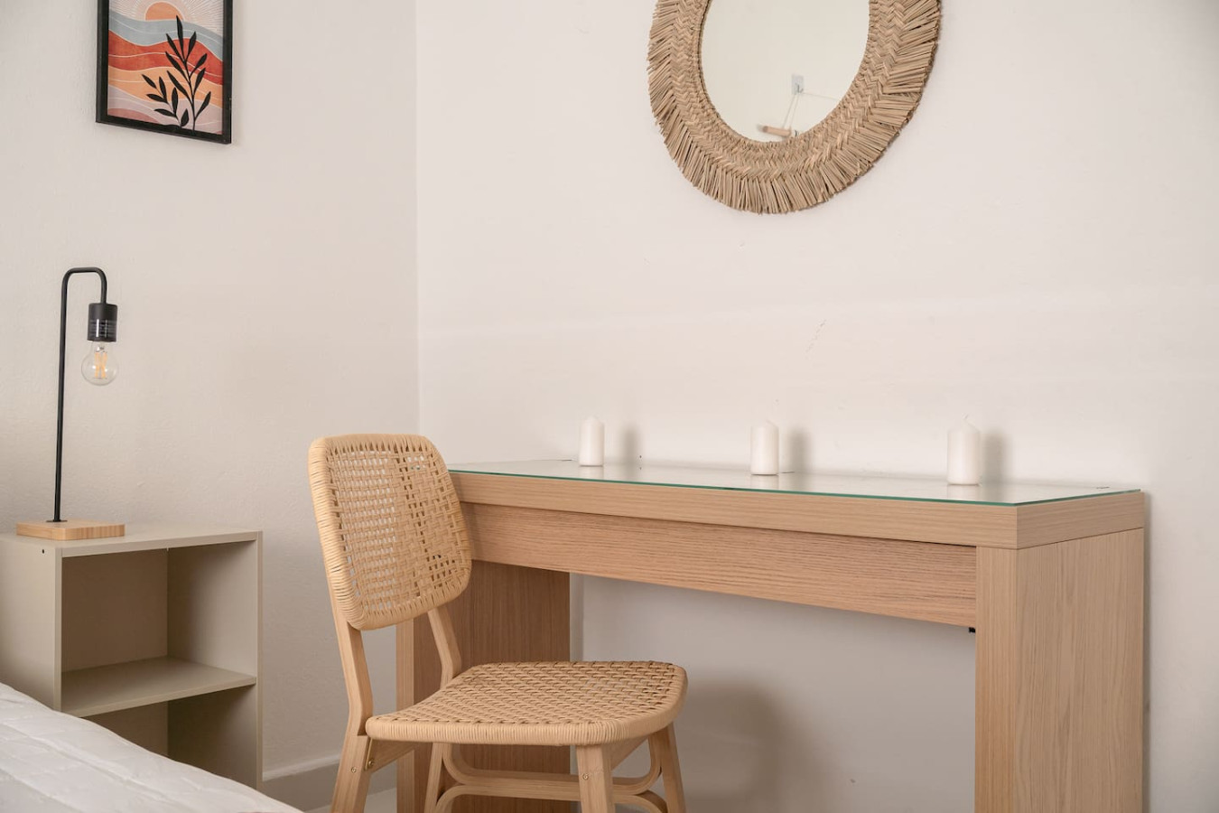 Bedroom desk with a rattan chair and a round mirror — Puerto Lagoon Downtown, Santurce