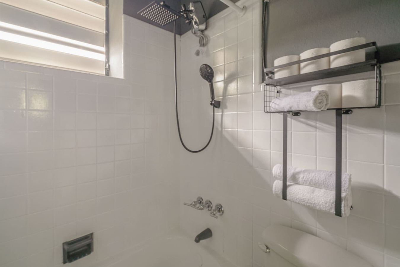 Bathroom with a tub, rain shower and towel rack — Puerto Lagoon Downtown, Santurce