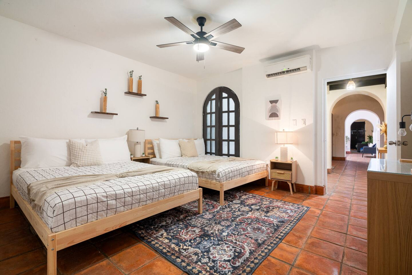 Bedroom with two beds and a ceiling fan — Villa Mansion - Fountain & Rooftop - Old San Juan
