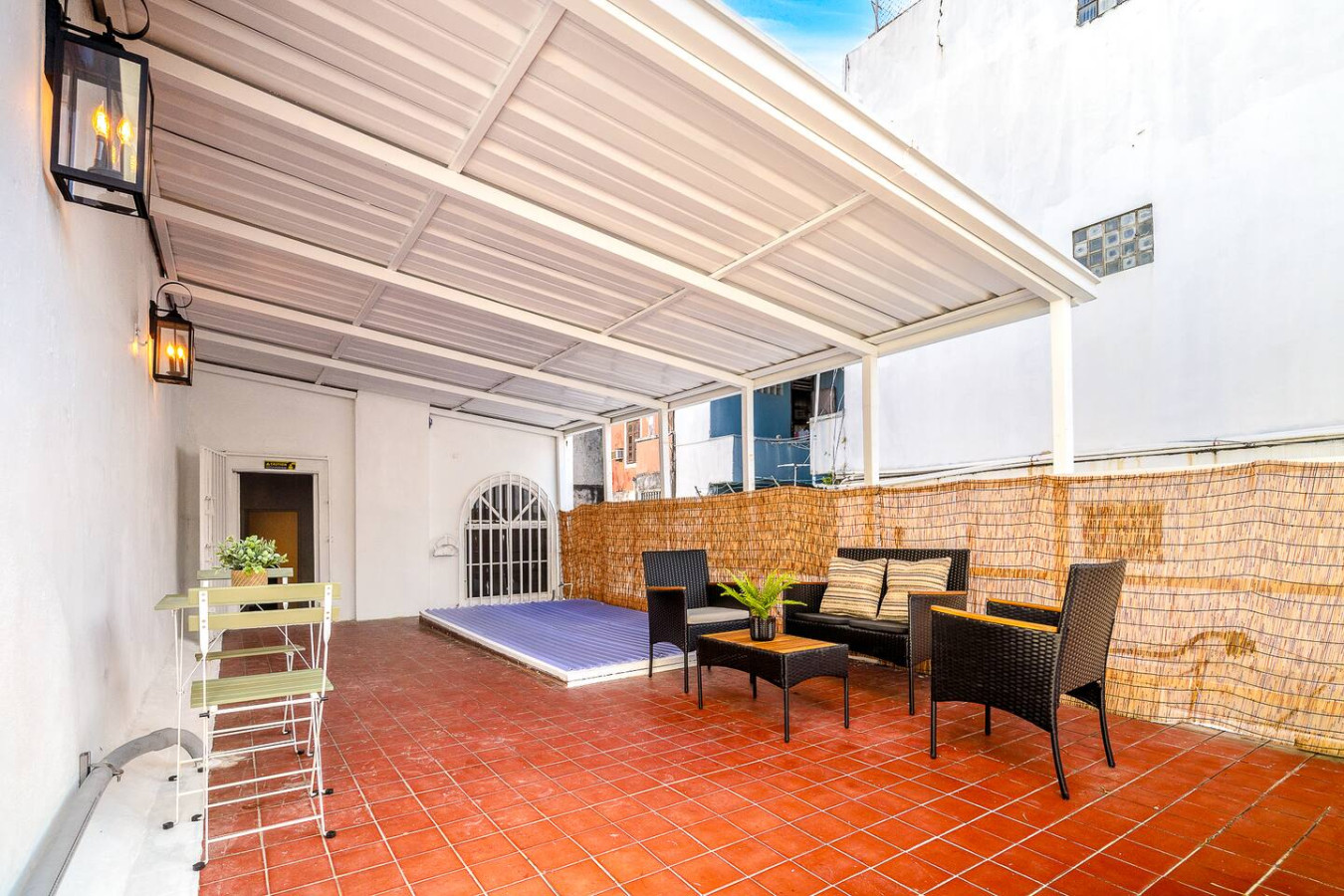 Patio with a blue tarp and a view of the ocean — Villa Mansion - Fountain & Rooftop - Old San Juan, Old San Juan