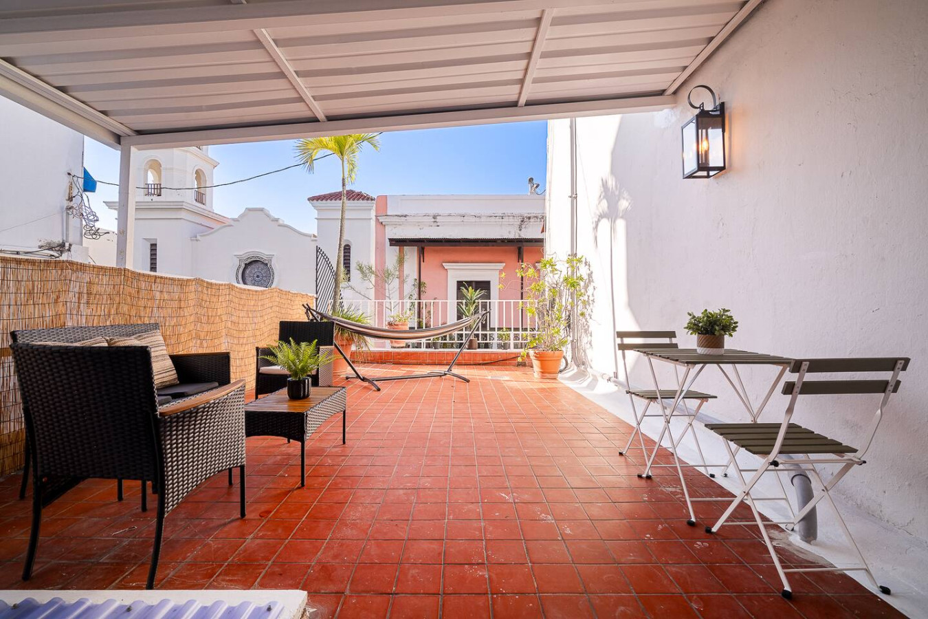 Patio with a hammock and a potted plant — Villa Mansion - Fountain & Rooftop - Old San Juan, Old San Juan