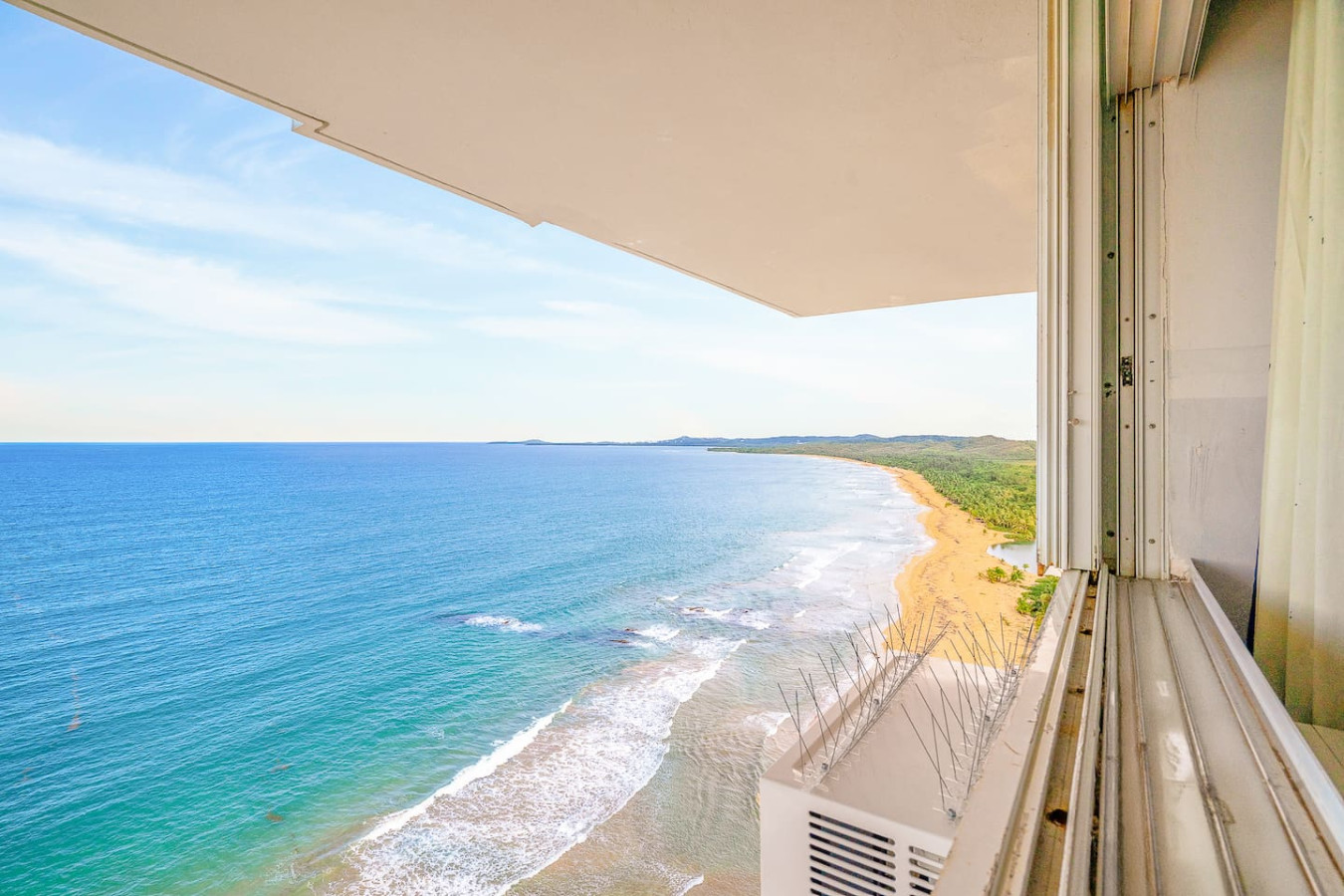 View of the ocean from the balcony of a vacation rental property in (balcony 3) — Captain’s Beachfront Luquillo Beach House, 