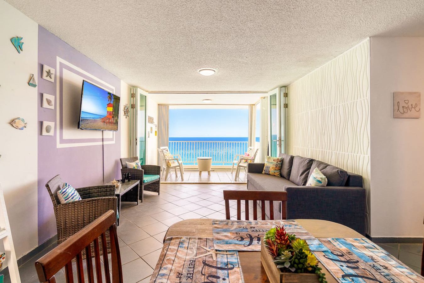 View of the ocean from the balcony of a vacation rental property in (balcony 7) — Captain’s Beachfront Luquillo Beach House, 