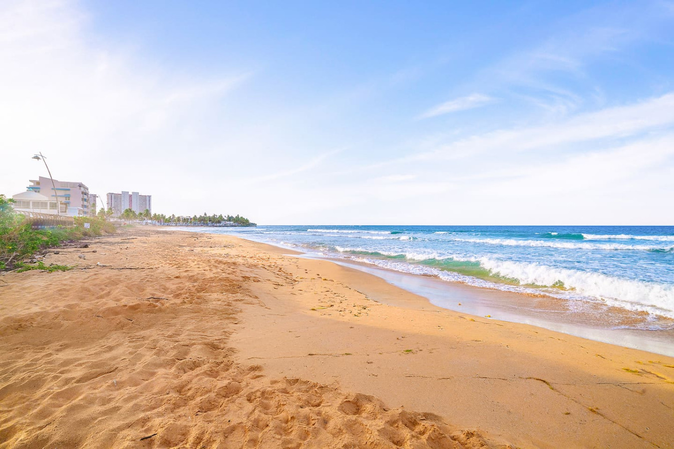 Beachfront view of a vacation rental property in Puerto Rico — Captain’s Beachfront Luquillo Beach House, Luquillo