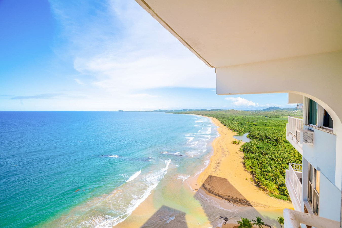 View of the ocean from the balcony of a vacation rental property in (balcony 5) — Captain’s Beachfront Luquillo Beach House, 