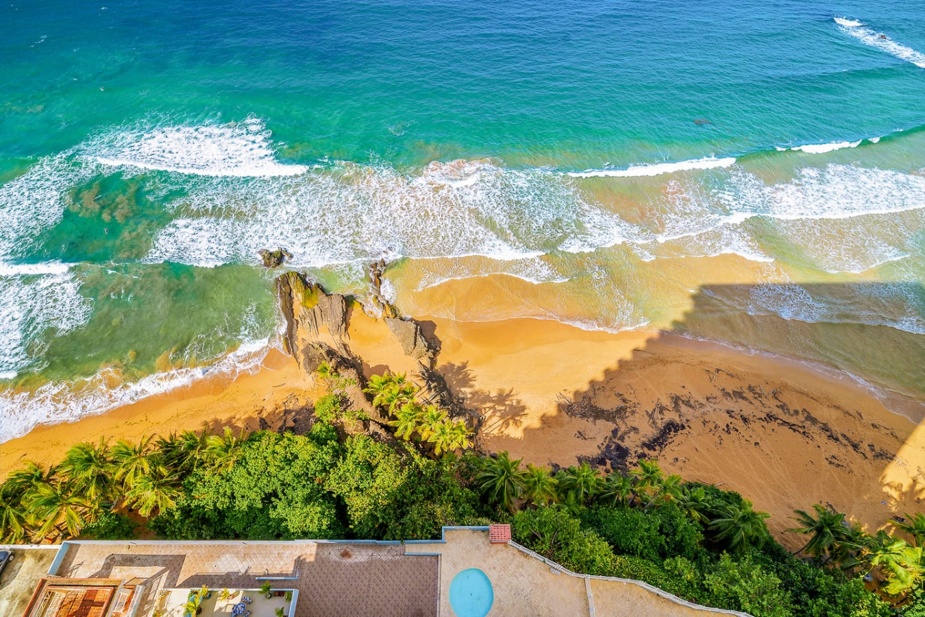 View of the ocean from the balcony of a vacation rental property in (balcony 6) — Captain’s Beachfront Luquillo Beach House, 