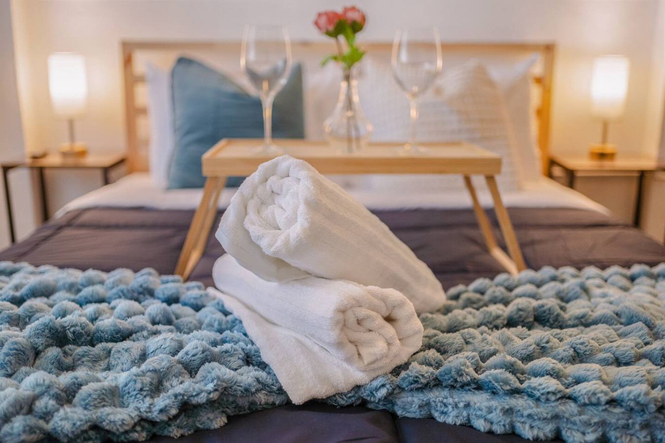 Bedroom with a bed and two towels on it — Tapia Mosaic Beachwalk - San Juan, Santurce