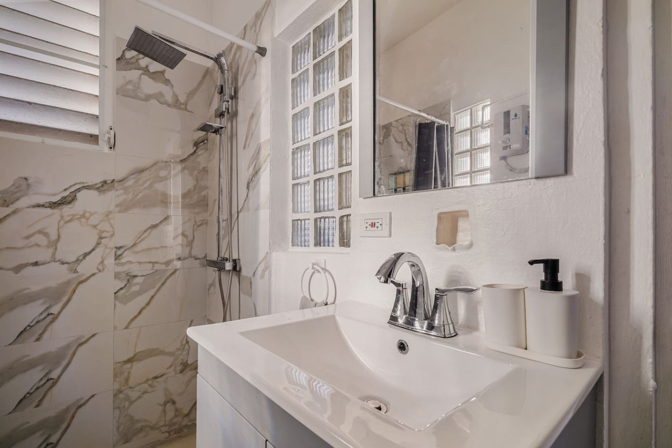 White bathroom with a shower and a sink — Tapia Mosaic Beachwalk - San Juan, Santurce