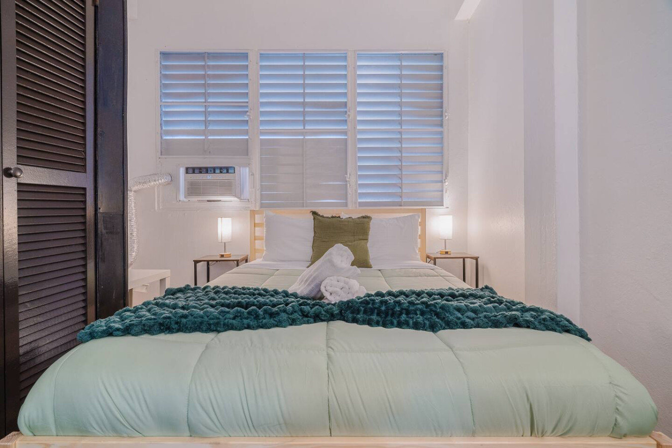 Bedroom with a bed and a window — Tapia Mosaic Beachwalk - San Juan, Santurce