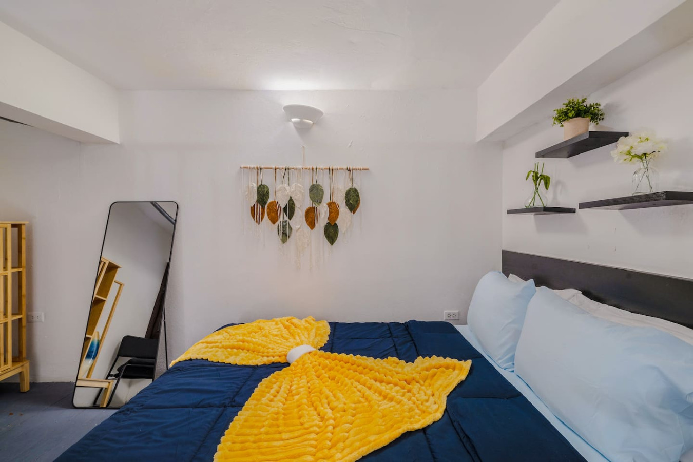Bedroom with a blue bedspread and yellow throw blanket (bedroom 2) — Loft La Luz - Old San Juan, Old San Juan