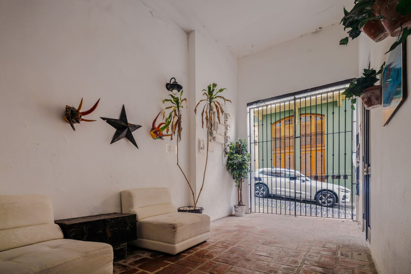 White car parked in front of a green building — Loft La Luz - Old San Juan, Old San Juan