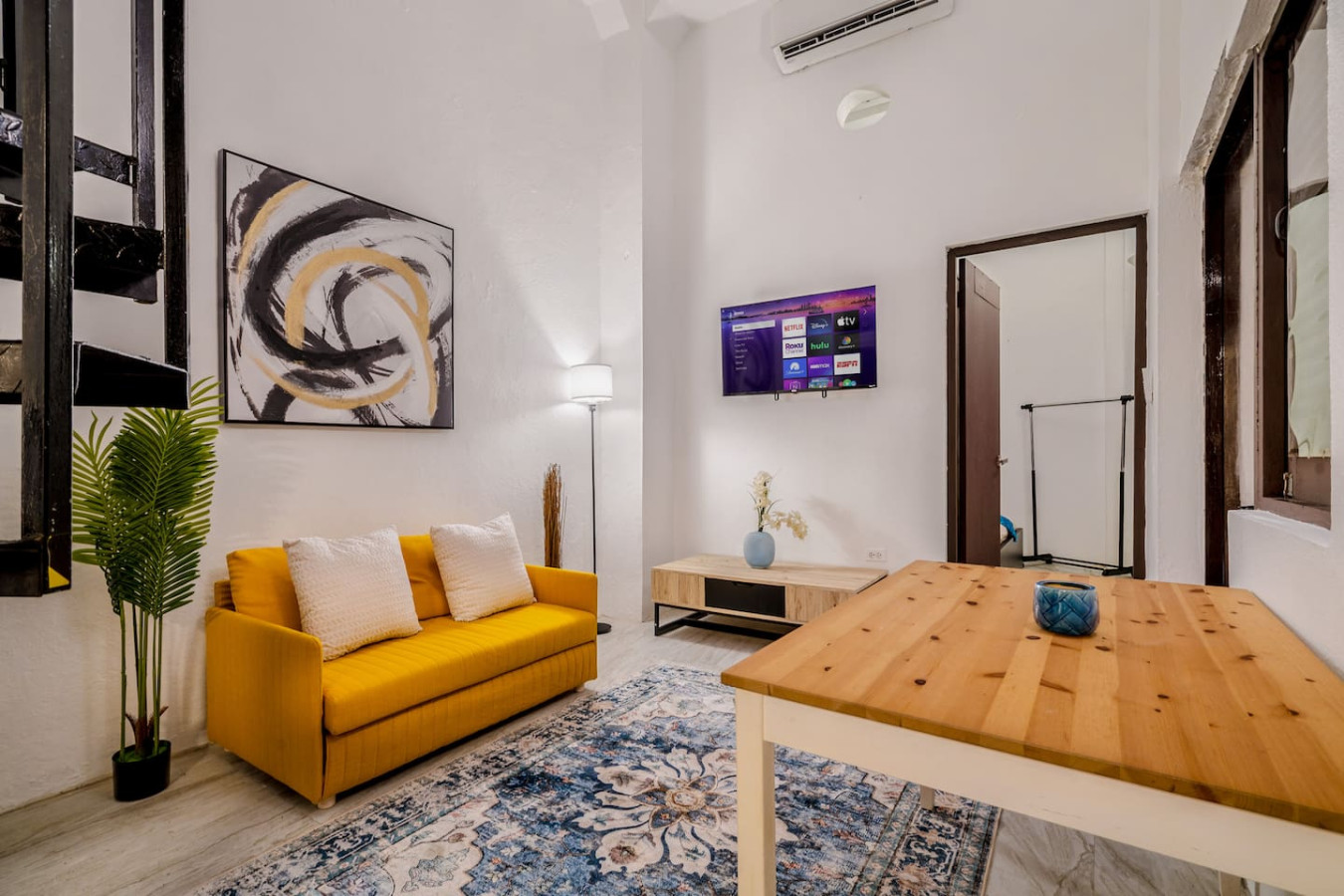Living room with a couch and a television — Loft La Luz - Old San Juan, Old San Juan