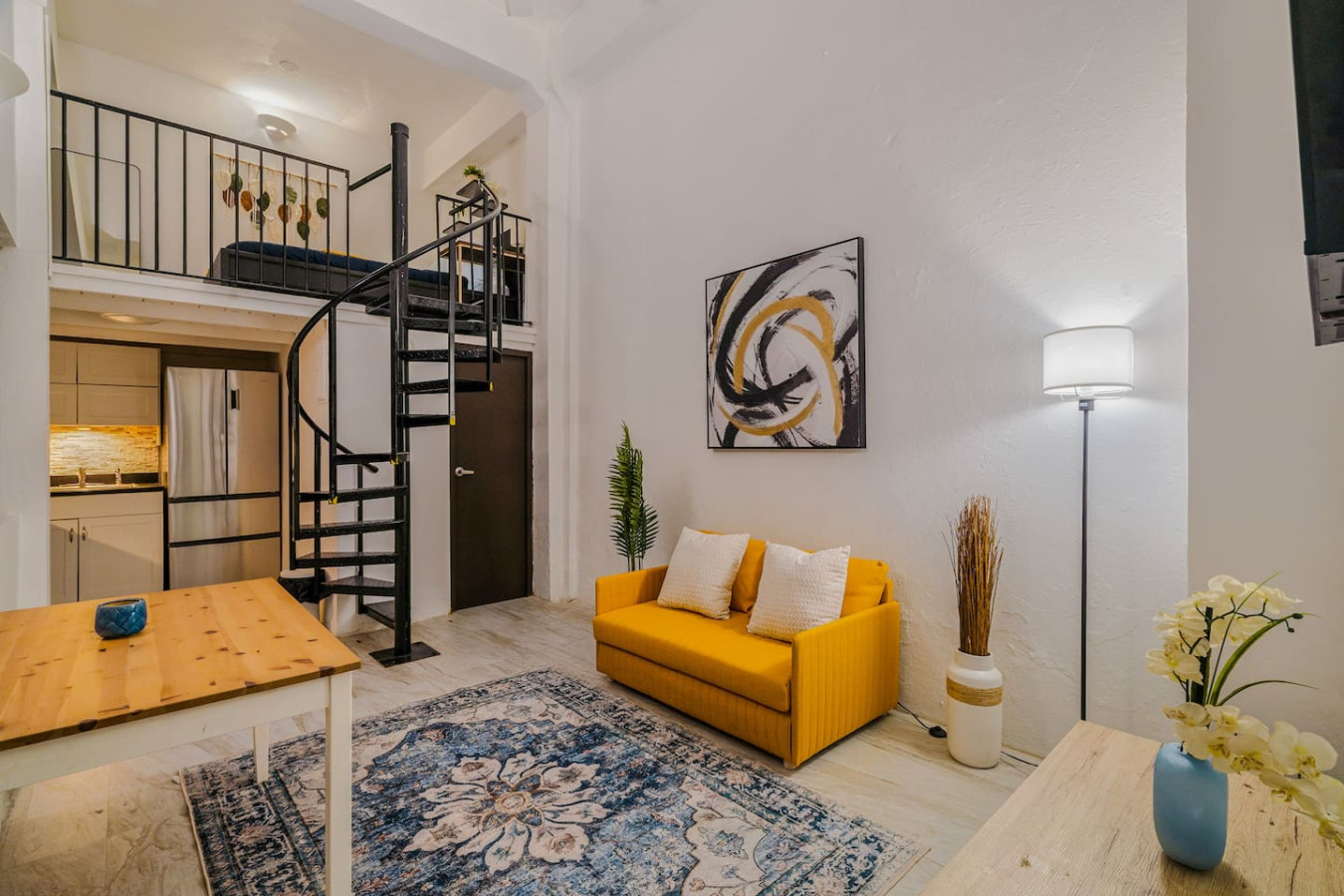 Living room with a yellow couch and a potted plant — Loft La Luz - Old San Juan, Old San Juan