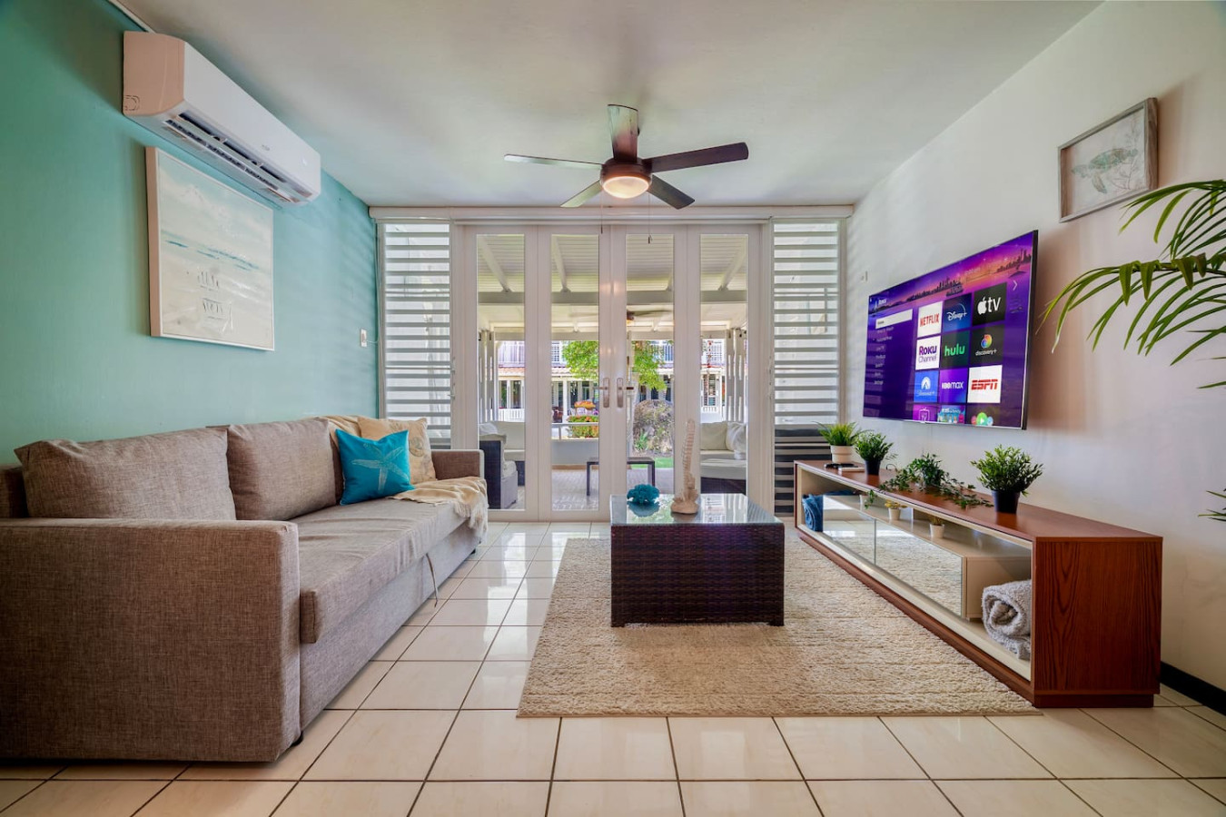 Living room with a couch, a coffee table, and a large flat screen TV — Beach Villa Dorado Del Mar, Dorado