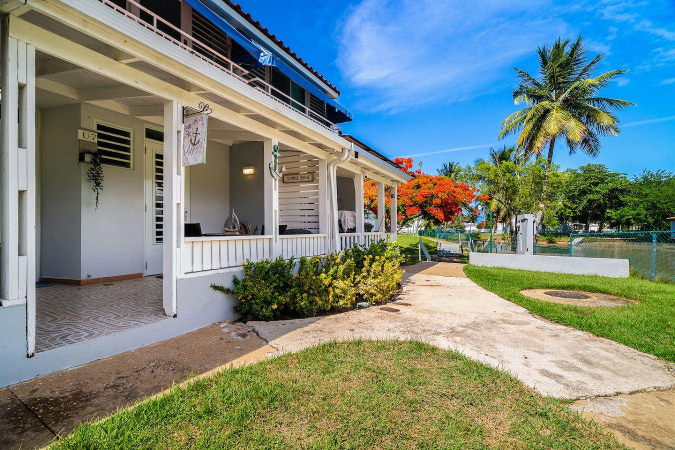 White house with a balcony and a view of the ocean — Beach Villa Dorado Del Mar, Dorado