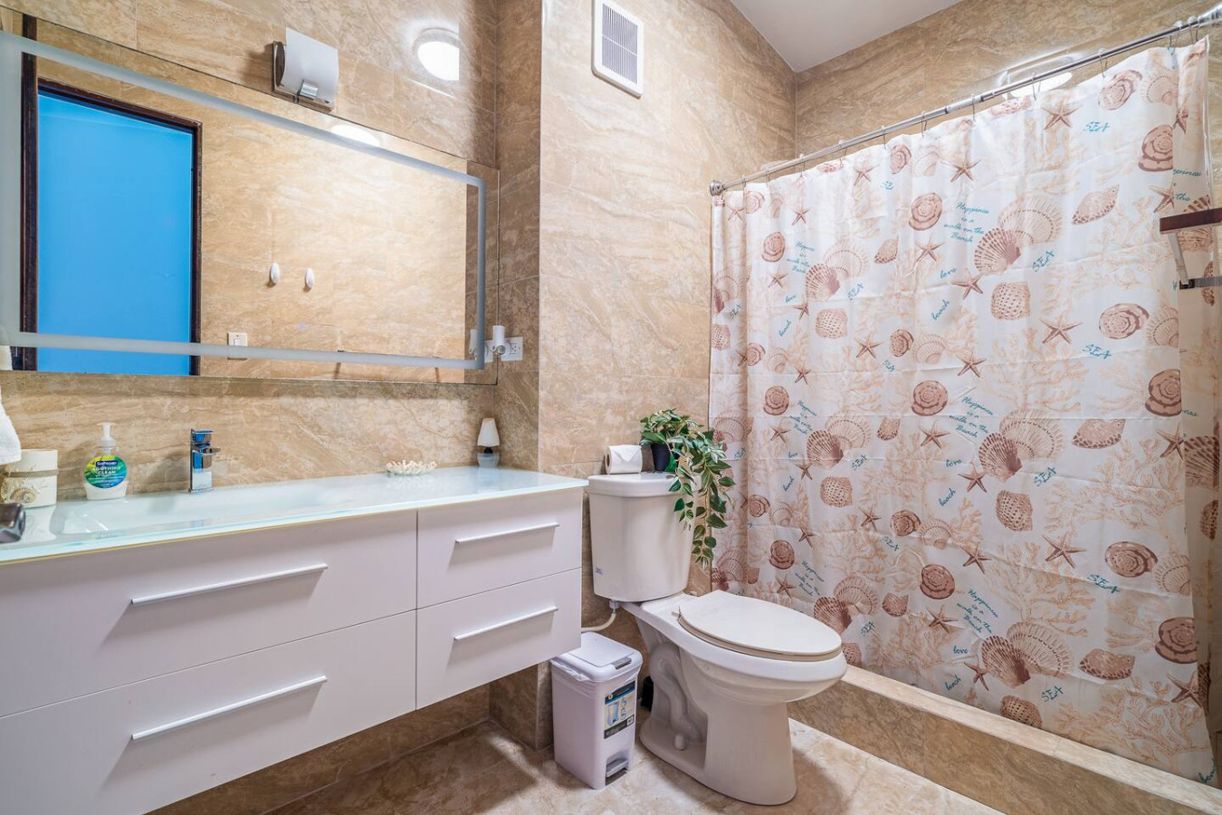 Bathroom with a white vanity and a shower curtain — Beach Villa Dorado Del Mar