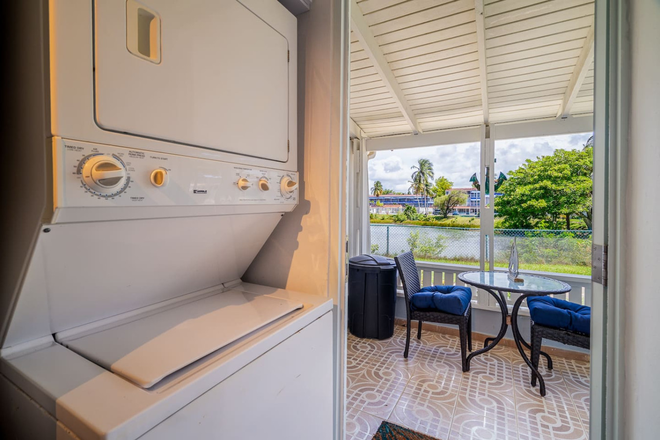Stacked washer and dryer by the patio door — Beach Villa Dorado Del Mar