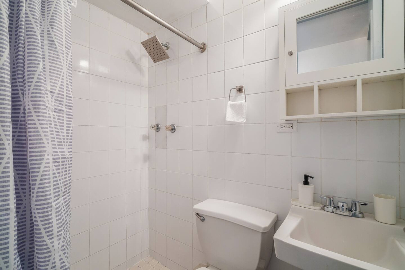 Bathroom with a shower, a toilet and a sink — Condado Grass Patio, Santurce