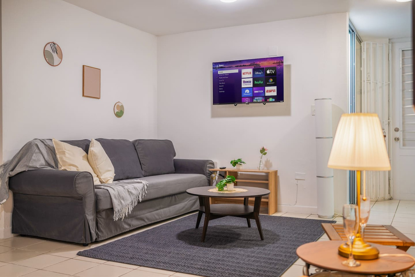 Grey couch in a living room (bedroom 2) — Condado Grass Patio, Santurce