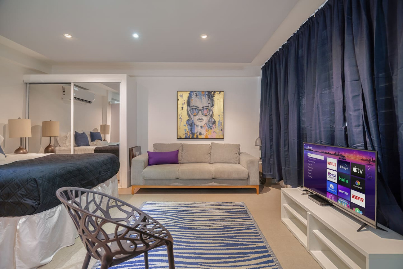 Living room with a couch and a painting on the wall — Punta Las Marias Studio - Short Walk to the Beach, Santurce