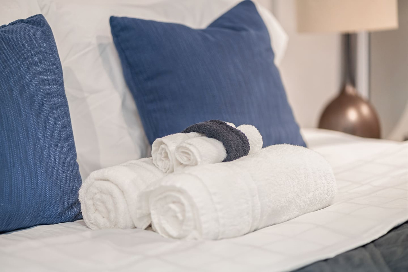 Two white towels folded on a bed — Punta Las Marias Studio - Short Walk to the Beach, Santurce