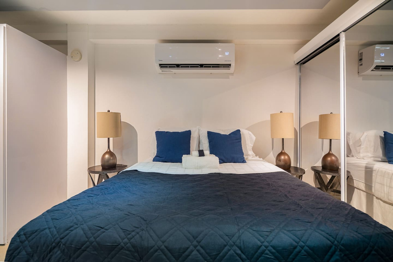 Bedroom with a bed, nightstands, and lamps — Punta Las Marias Studio - Short Walk to the Beach, Santurce