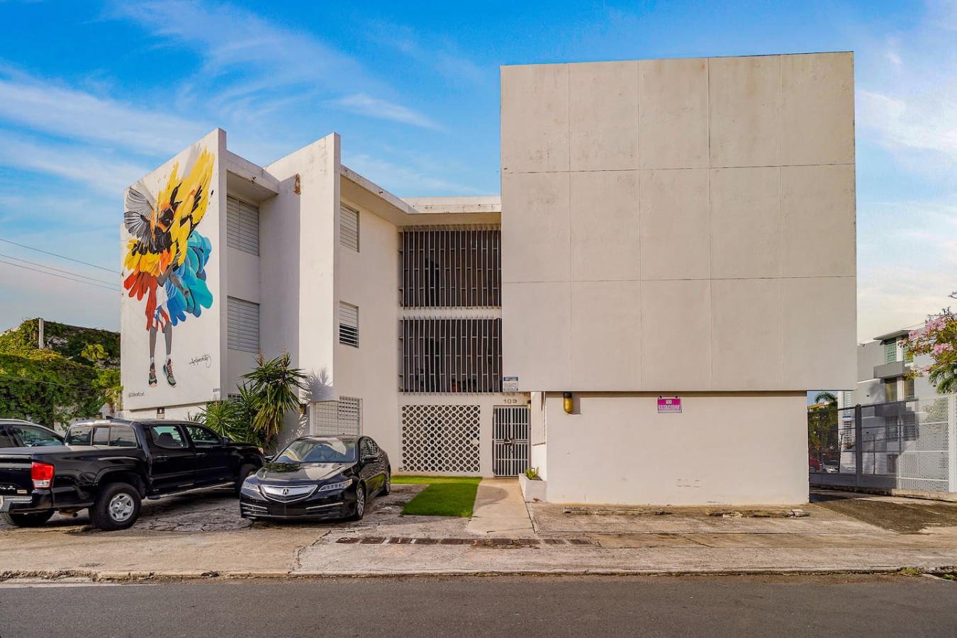 Black car parked in front of a white building — Punta Las Marias Studio - Short Walk to the Beach, Santurce
