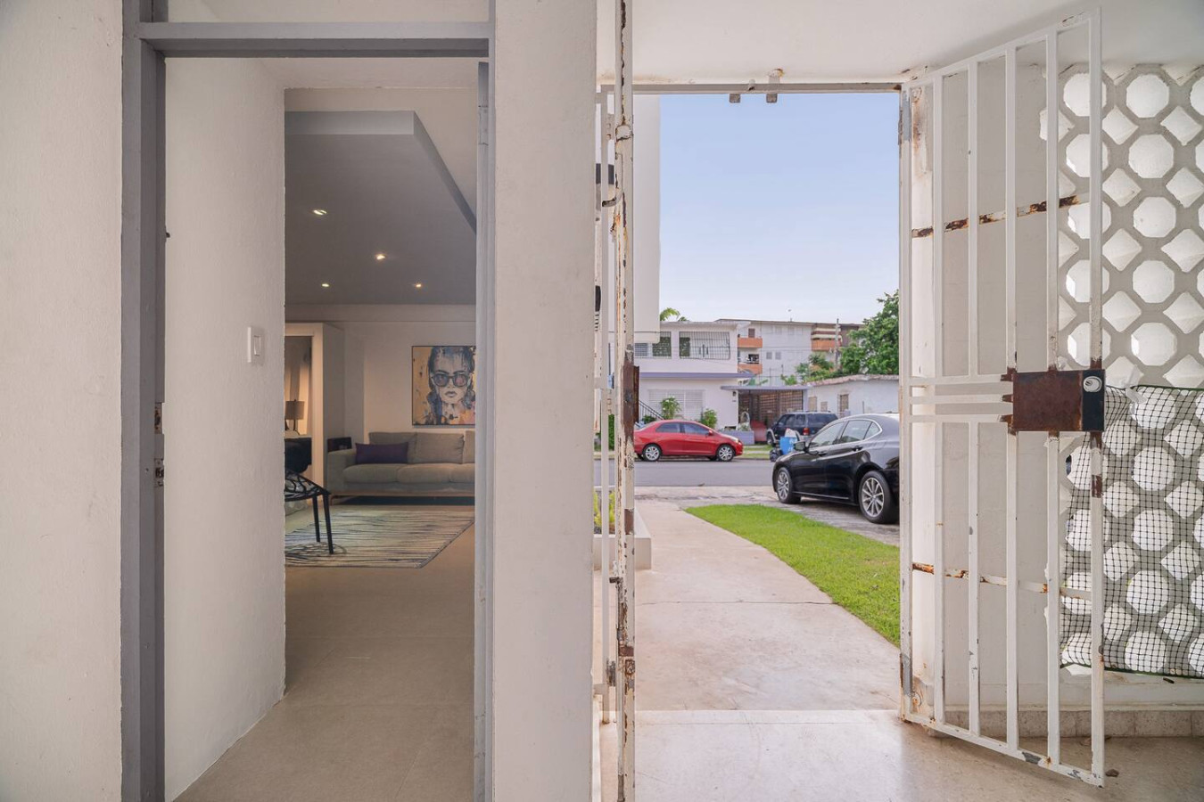 Red car parked in front of a house — Punta Las Marias Studio - Short Walk to the Beach, Santurce