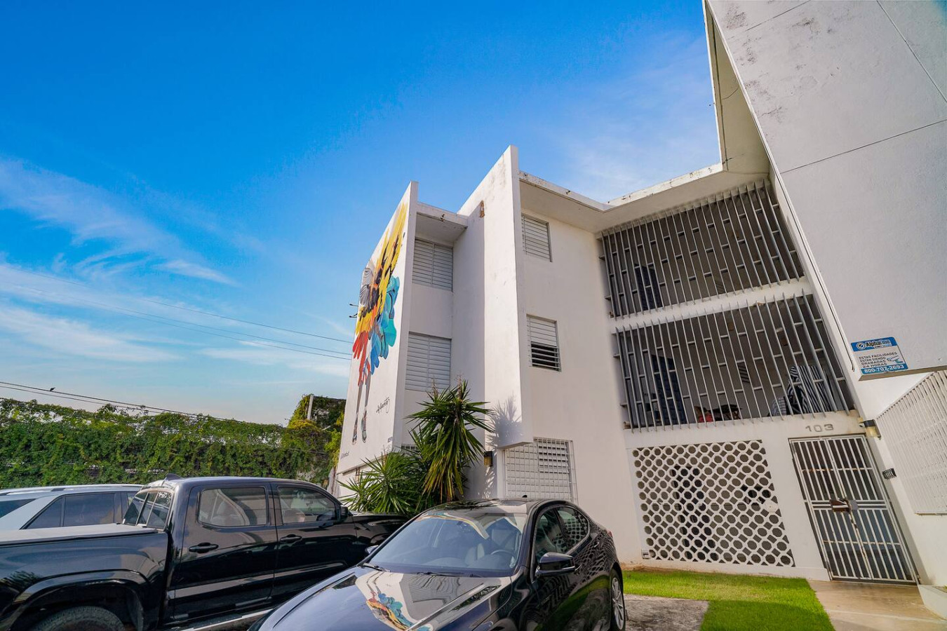White building with a blue mural on the side of it — Punta Las Marias Studio - Short Walk to the Beach, Santurce