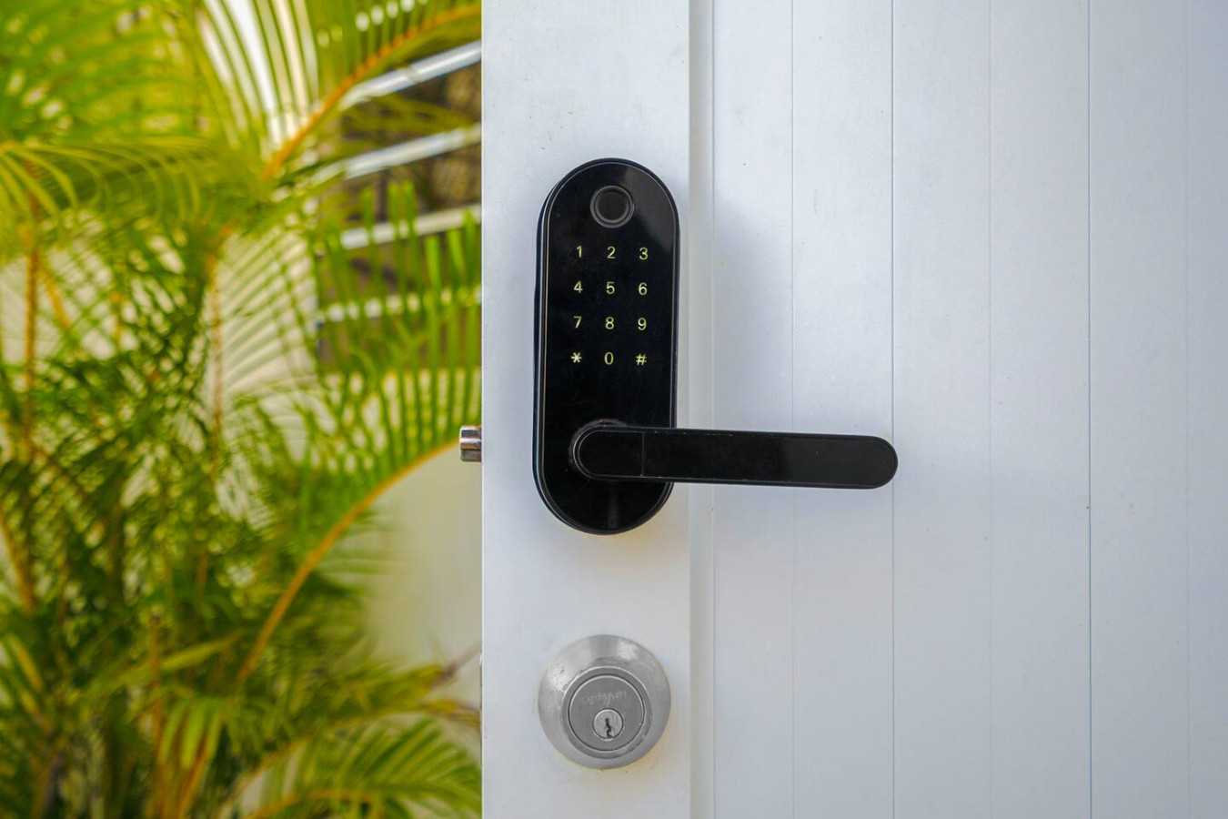 White door with a black lock and a black keypad — Downtown San Juan Gateway Dream, Santurce