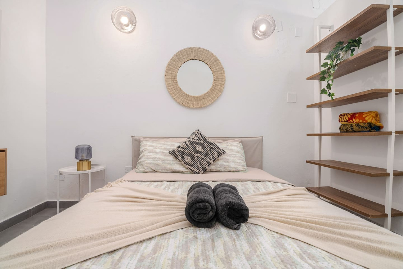 Bedroom with a bed, mirror, and two pillows — Downtown San Juan Gateway Dream, Santurce
