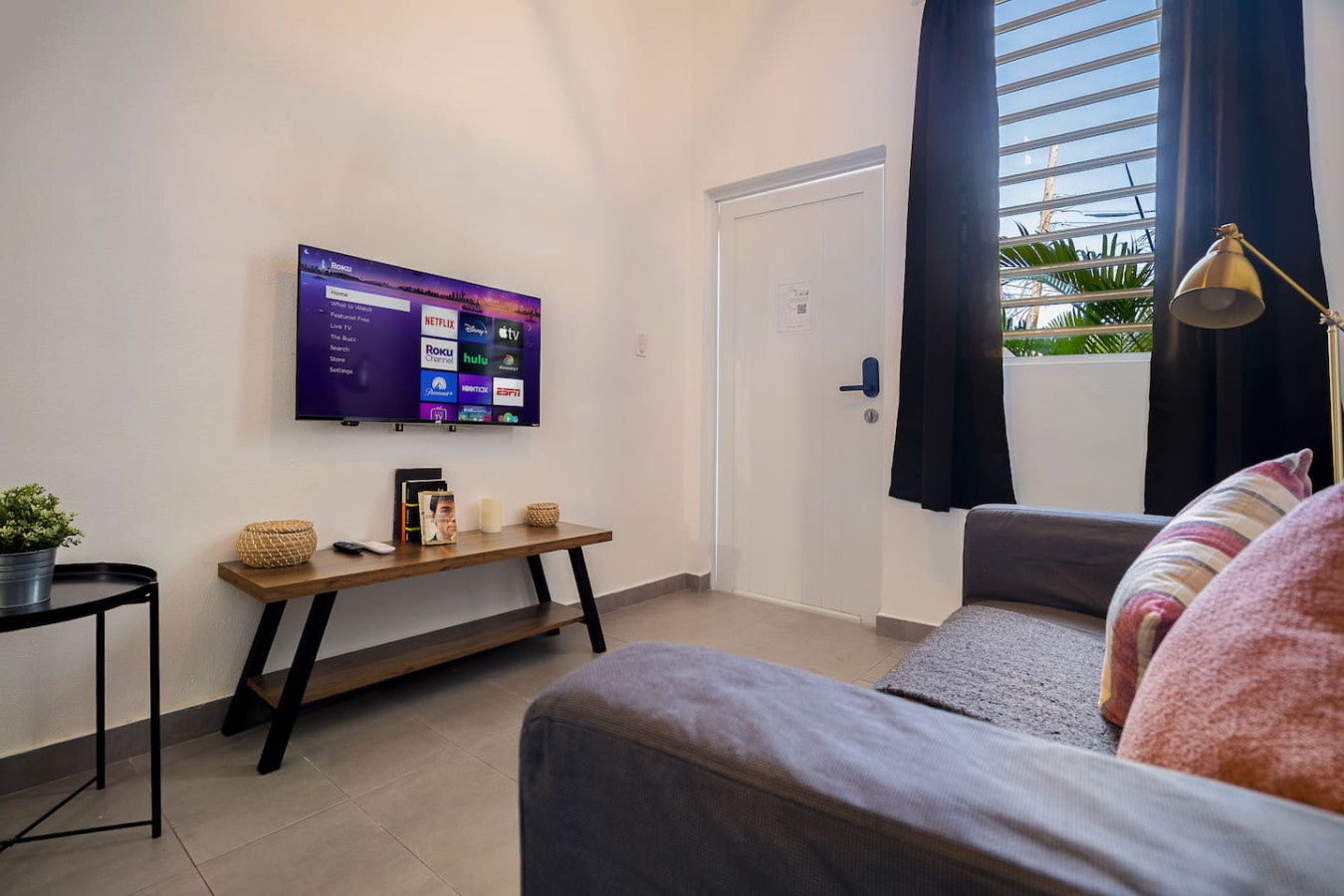 Flat screen TV on a wooden stand — Downtown San Juan Gateway Dream, Santurce