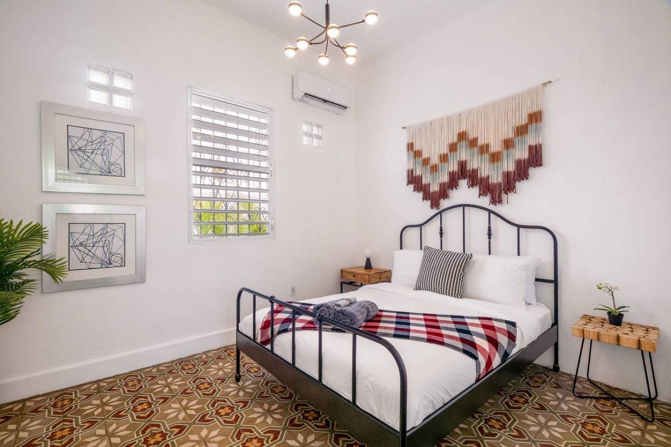 Bedroom with a bed and a view of the ocean — Luz Collection No.2 – Casa Brisa | 3BR Retreat, Santurce