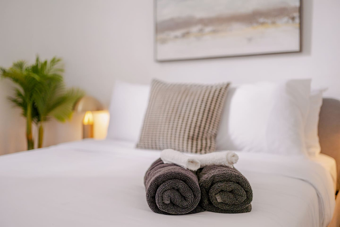 Two towels rolled up on a bed — Luz Collection No.2 – Casa Brisa | 3BR Retreat, Santurce