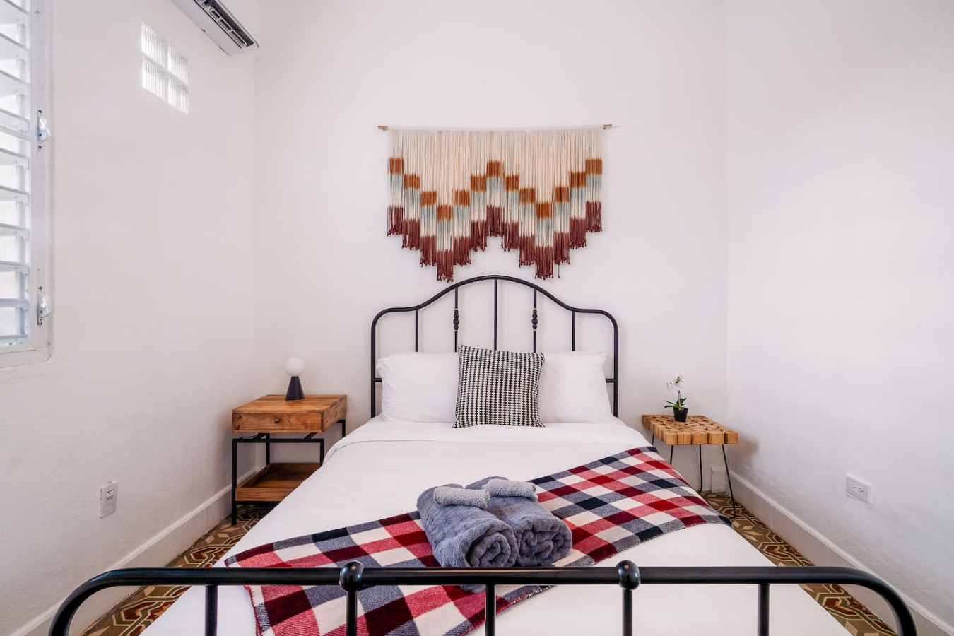 Bedroom with a bed, a chair, and a rug — Luz Collection No.2 – Casa Brisa | 3BR Retreat, Santurce
