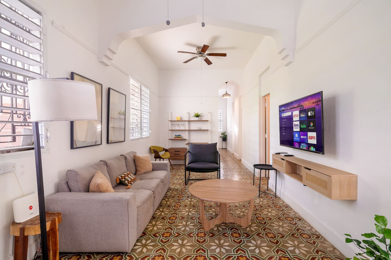 Living room with a couch and a flat screen TV — Luz Collection No.2 – Casa Brisa | 3BR Retreat, Santurce