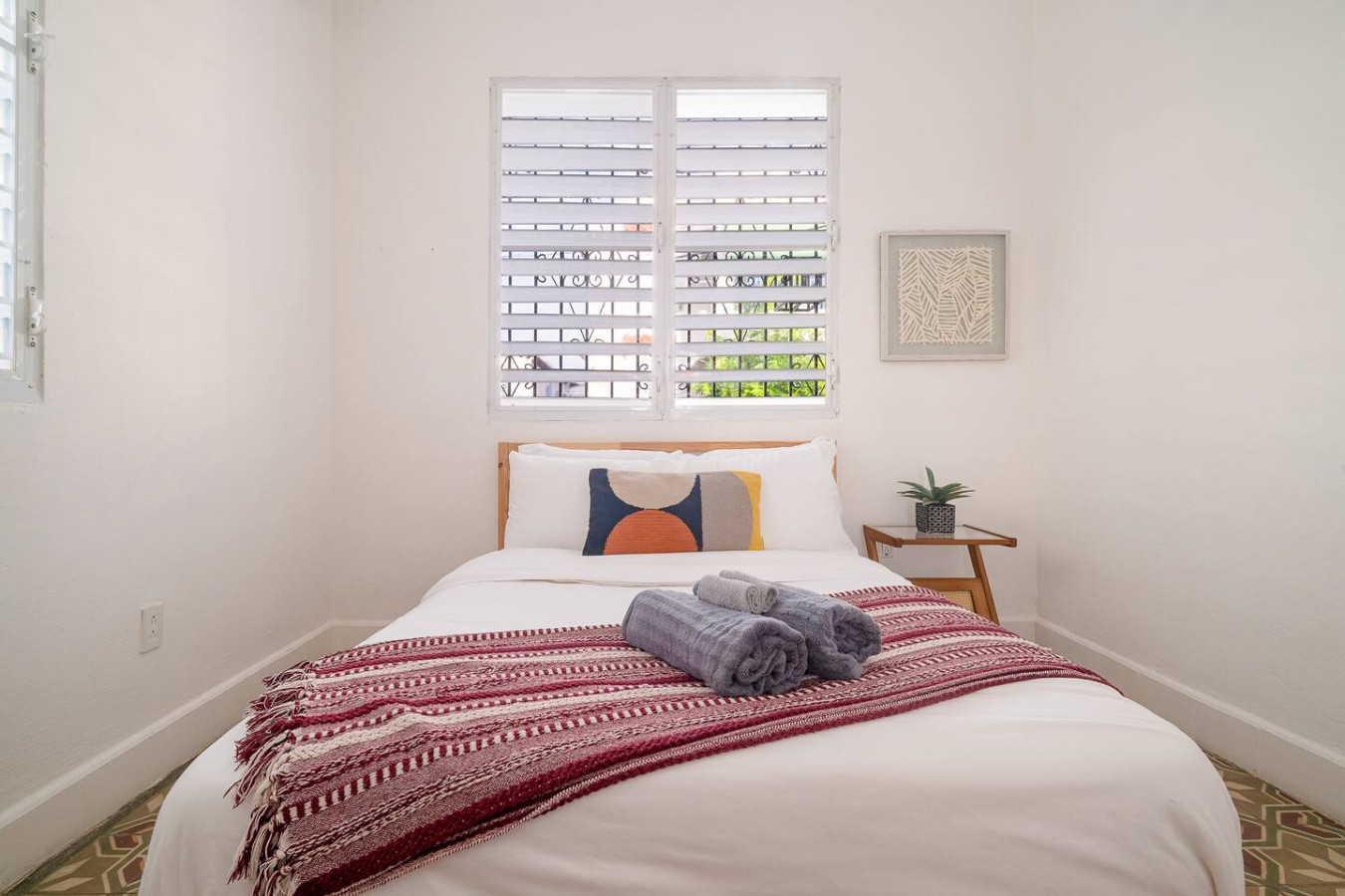 Bedroom with a bed and a red blanket — Luz Collection No.2 – Casa Brisa | 3BR Retreat, Santurce