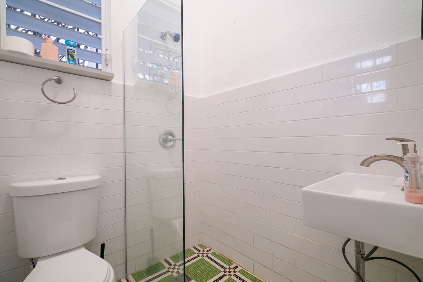Bathroom with white subway tile and a glass shower — Luz Collection No.2 – Casa Brisa | 3BR Retreat, Santurce