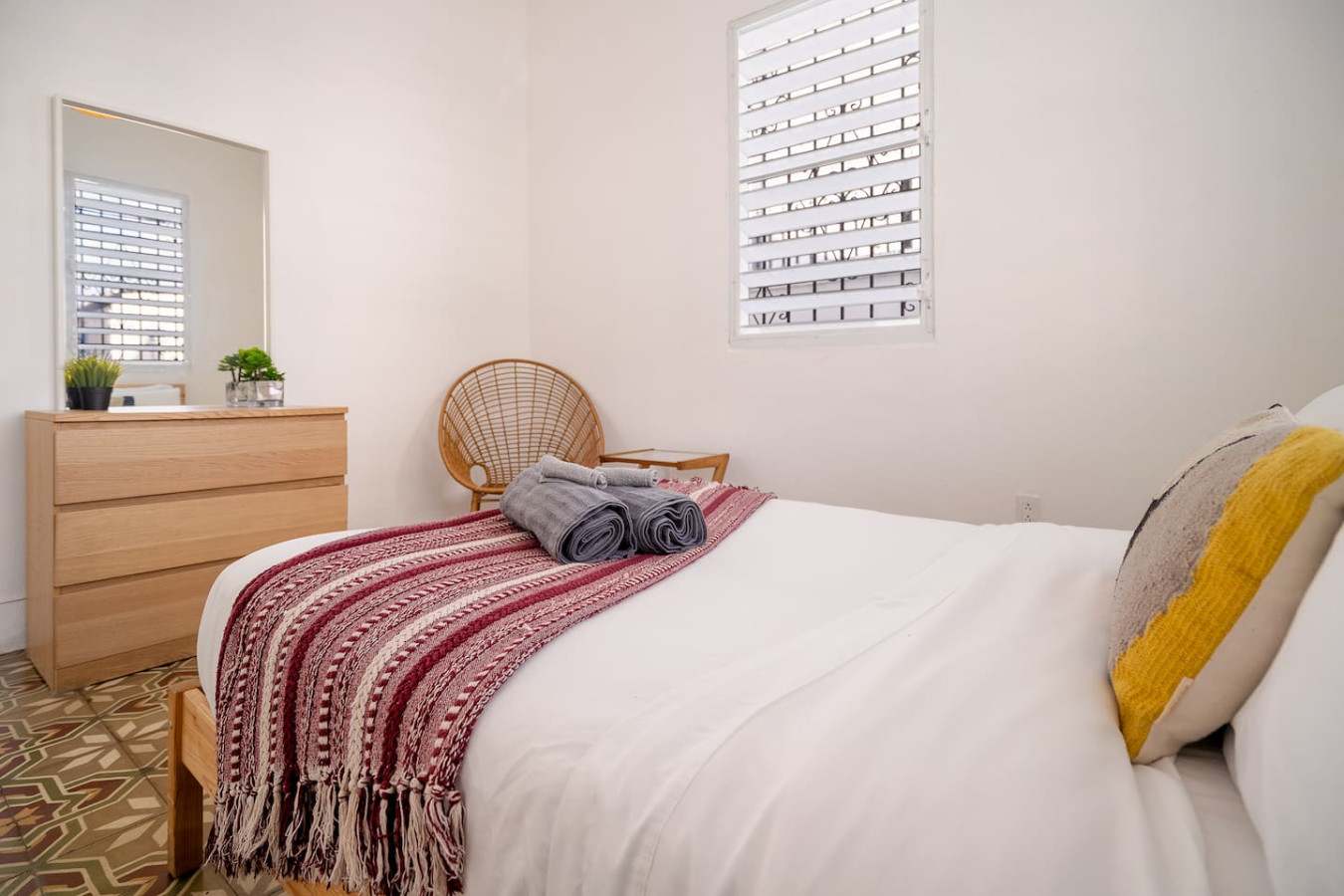 Bedroom with a bed, chair, and red blanket on it — Luz Collection No.2 – Casa Brisa | 3BR Retreat, Santurce