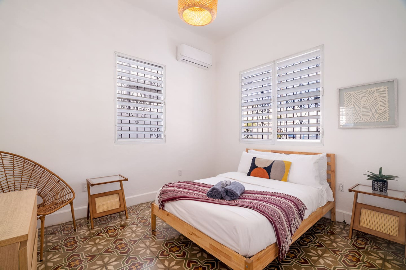 Bedroom with a bed, a chair, and a table — Luz Collection No.2 – Casa Brisa | 3BR Retreat, Santurce
