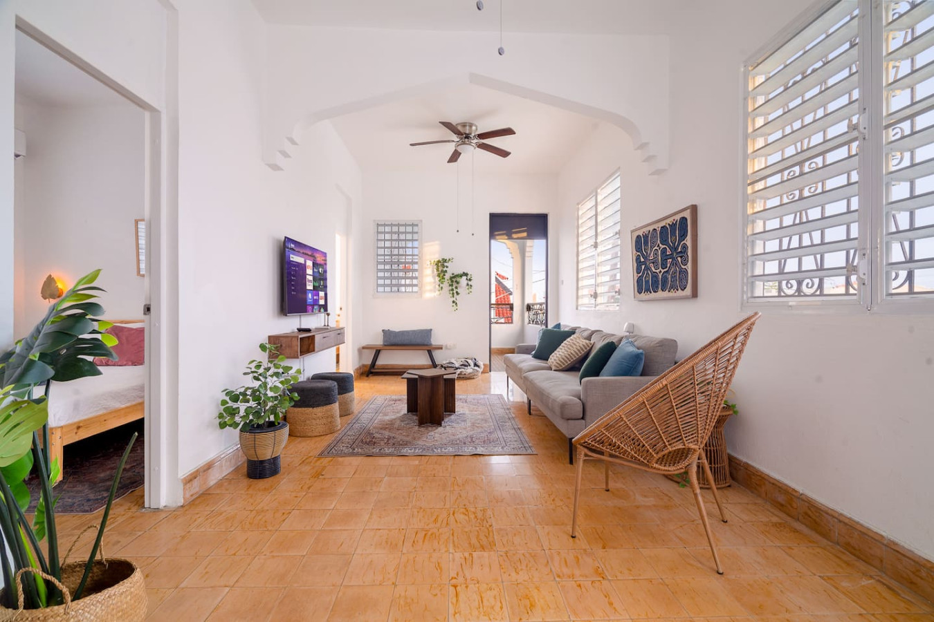 Living room with a couch, a chair, a coffee table, and a TV — Luz Collection No.3 – Casa Horizonte | 3BR Loft, Santurce