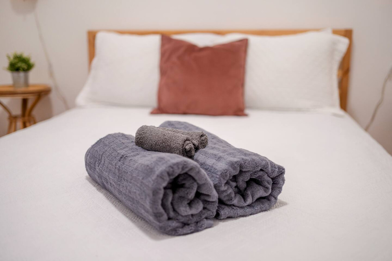 Bedroom with a bed and a pillow — Luz Collection No.3 – Casa Horizonte | 3BR Loft, Santurce
