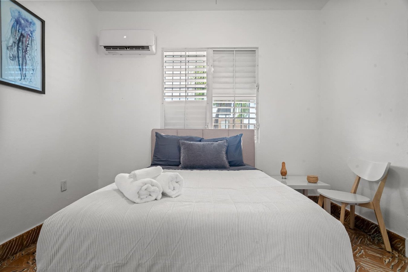 Bedroom with a white bed and two pillows — Sunkiss in puerto Rico San Juan 3 Bedroom, Santurce