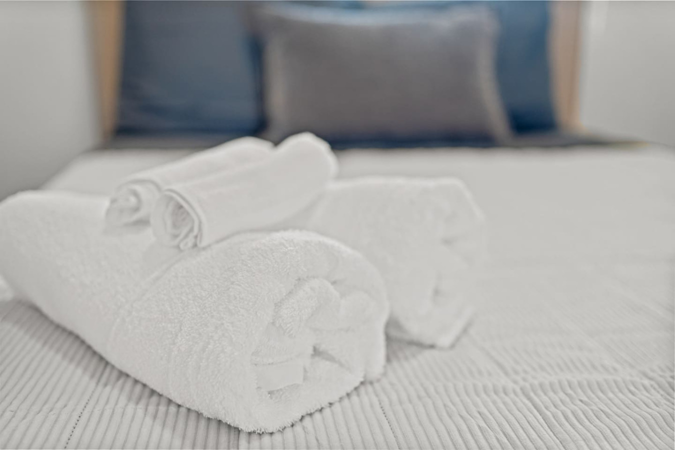 Two white towels folded on a bed — Sunkiss in puerto Rico San Juan 3 Bedroom, Santurce