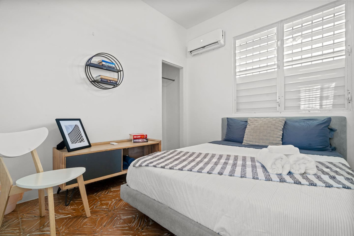 Bedroom with a bed, nightstand, and a picture on the wall — Sunkiss in puerto Rico San Juan 3 Bedroom, Santurce