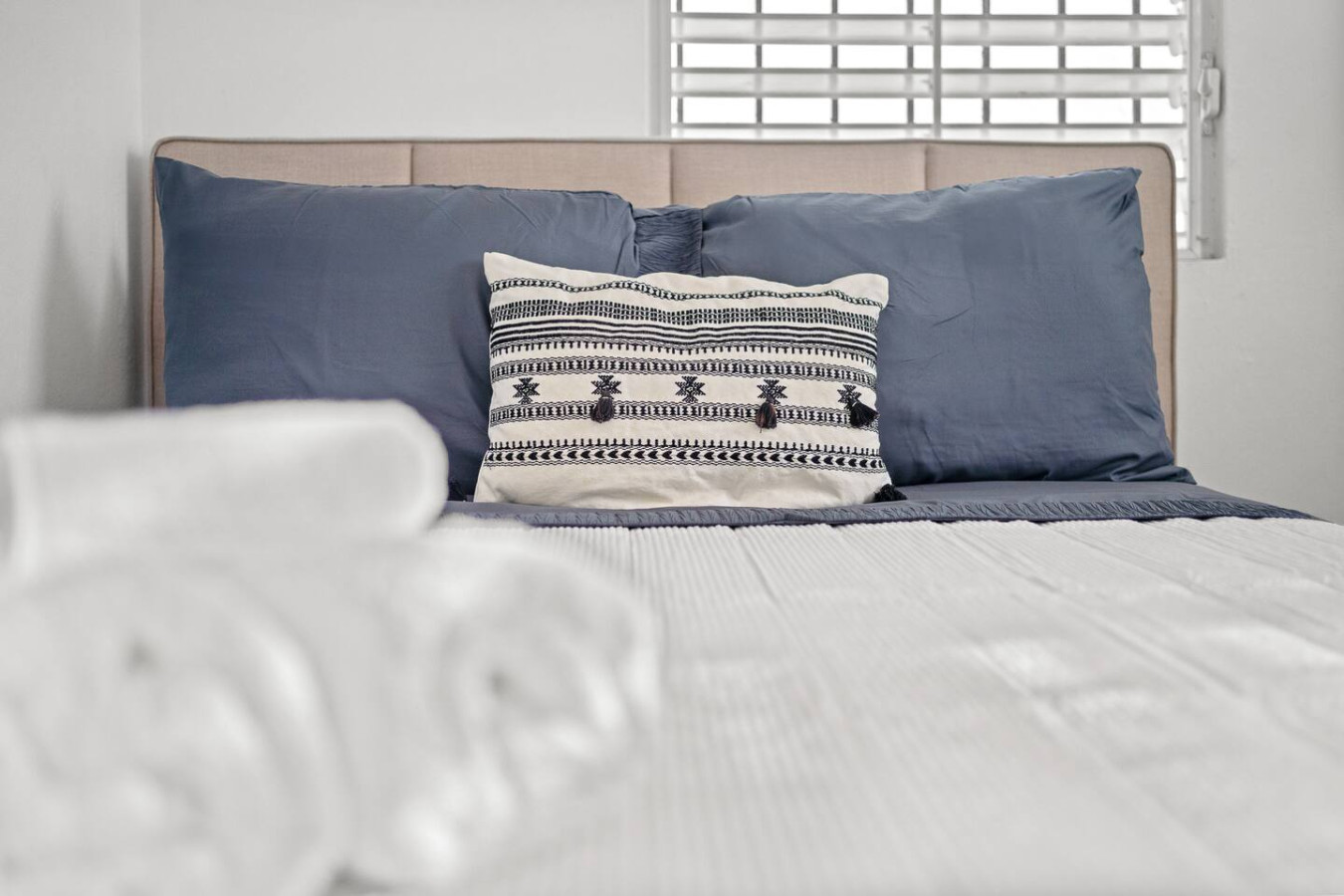 Bedroom with a blue bedspread and a white pillow — Sunkiss in puerto Rico San Juan 3 Bedroom, Santurce