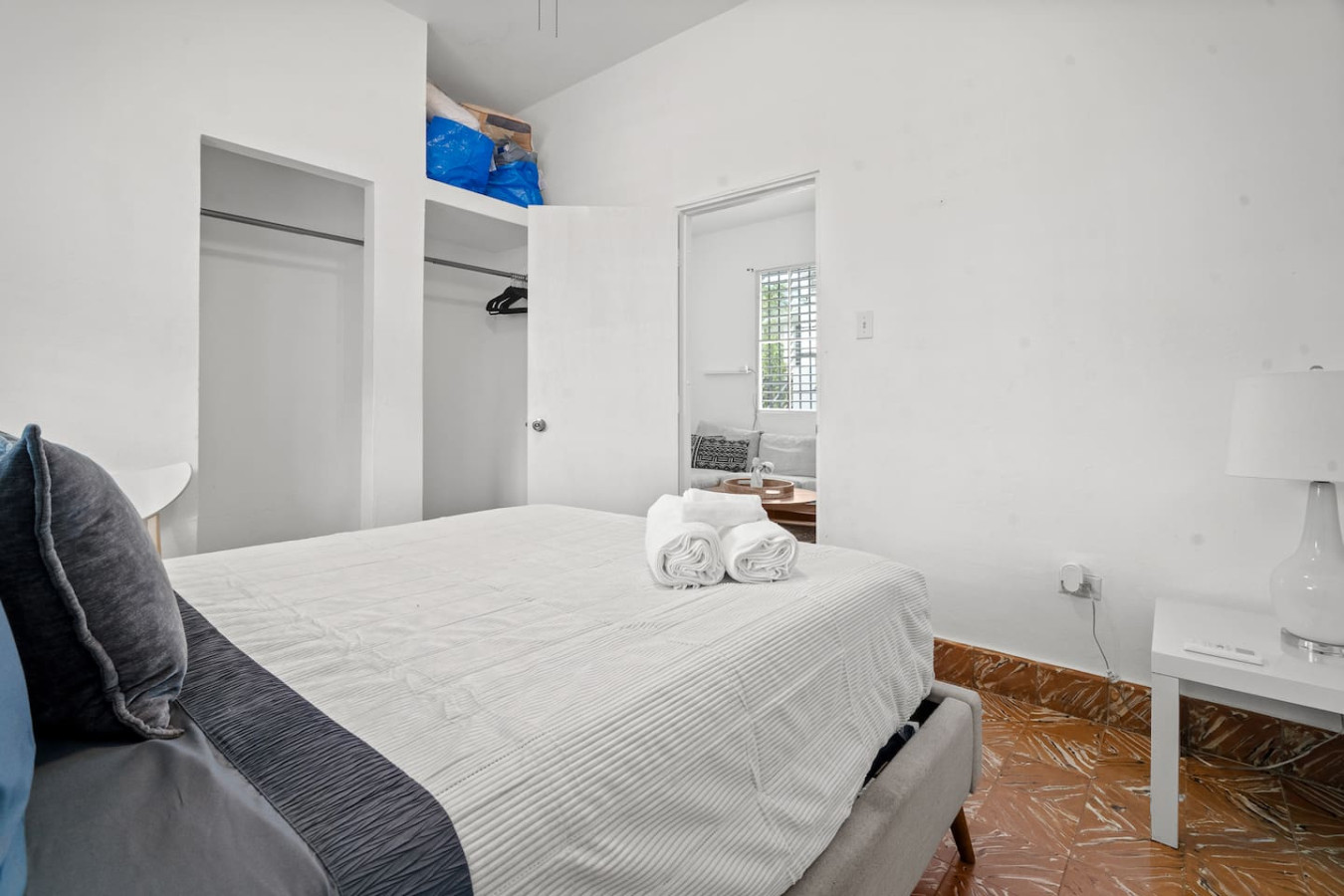 Bedroom with two closets and a white table lamp — Sunkiss in Puerto Rico San Juan 3 Bedroom, Santurce