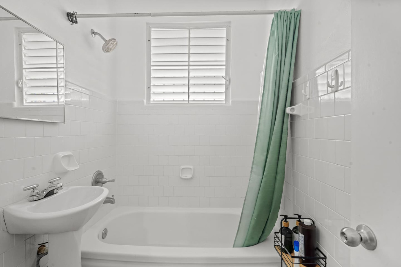 Bathroom with a bathtub and a pedestal sink — Sunkiss in Puerto Rico San Juan 3 Bedroom, Santurce